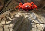 Ozdobny czerwone pająk na szarym tle