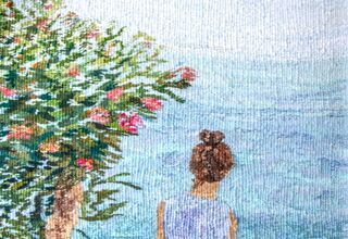 Gobelin przedstawiający kobietę patrzącą w stronę morza
