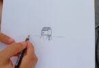 Ręka z ołówkiem tworzy szkic domku